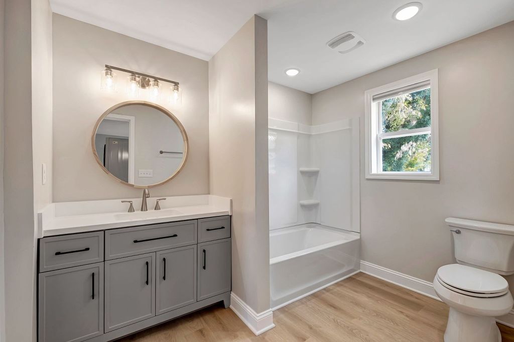 Bathroom vanity remodel with modern countertop and storage